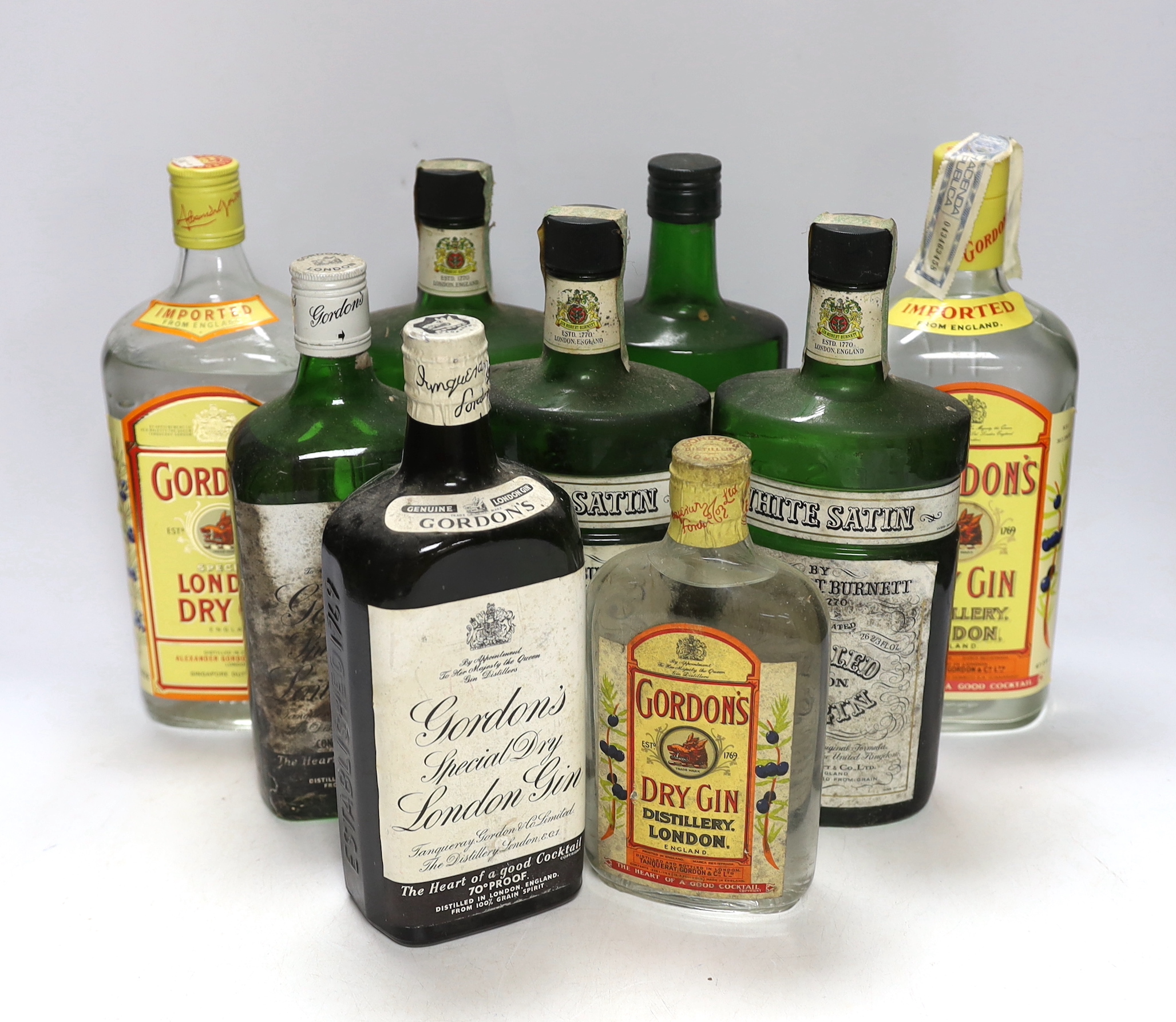 Eight and a half bottles of gin; Gordons, White Satin and Burnetts